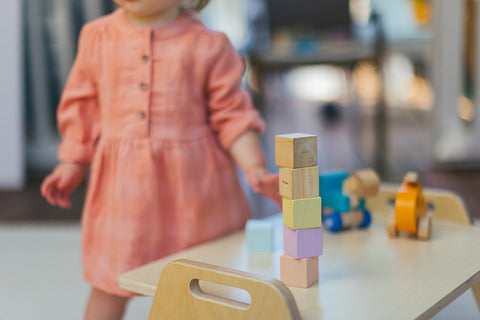 child stacking blocks