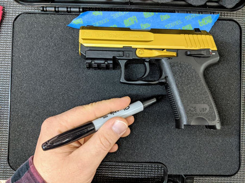 A pistol laying in position to be traced on a foam insert