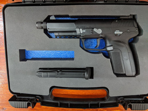 A cut foam insert fitted with a pistol and magazine