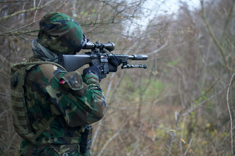 Hunter aiming a rifle