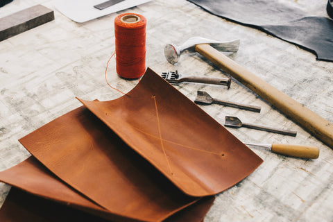 Craftsman's leather and tools for cutting leather