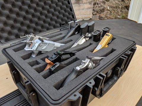 Multiple handgun and accessories gun case with pistols and accessories.