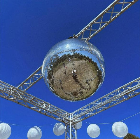 lighting truss structure holding a massive mirror ball