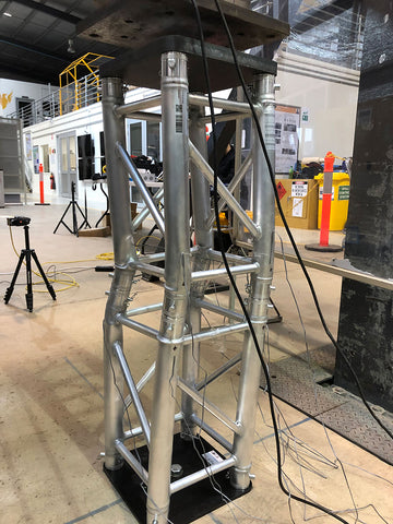 2 connected pieces of 0.5 metre Titan AV 290 box truss crushed inside a testing facility