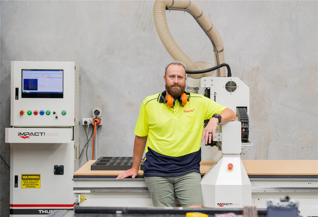 Rick at the helm of Titan AV’s CNC machine. Photo by Terri Hanlon Photography.