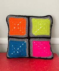 Bright color granny square throw pillow with gray verso