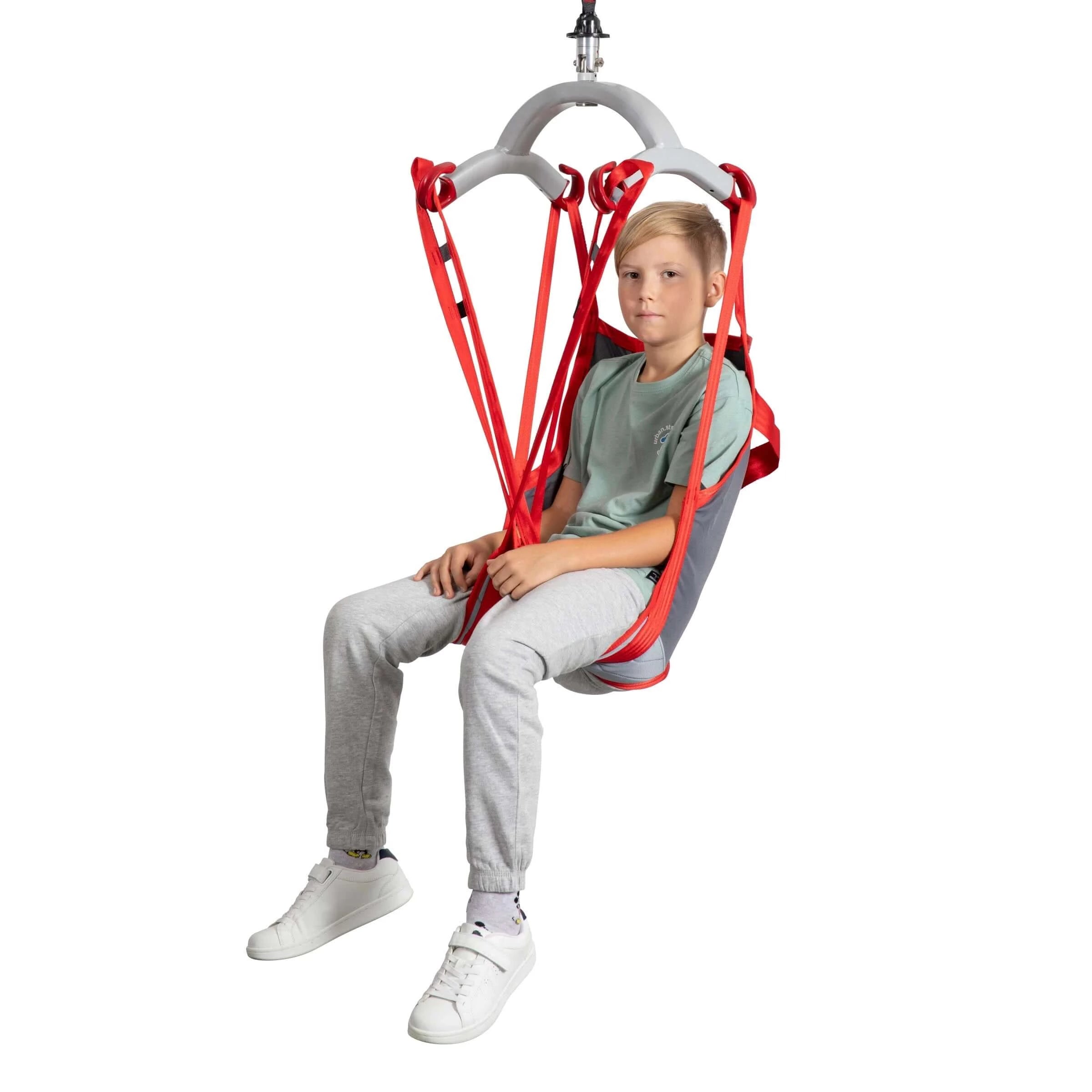 RgoSling MediumBack Padded Patient Sling used by child looking at camera with a front view