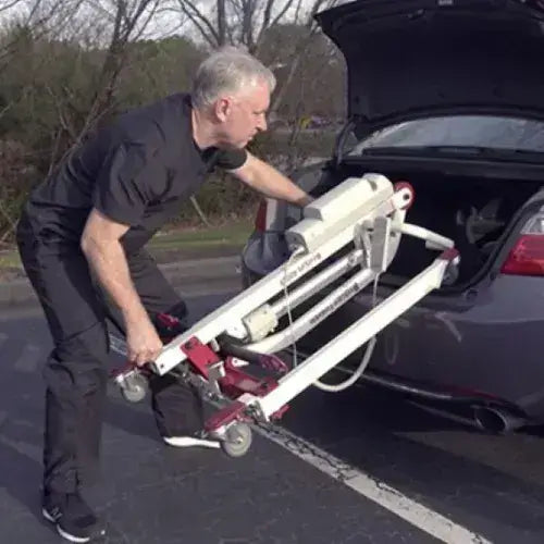 bestcare bestlift pl400ef foldable patient lift being folded up into car