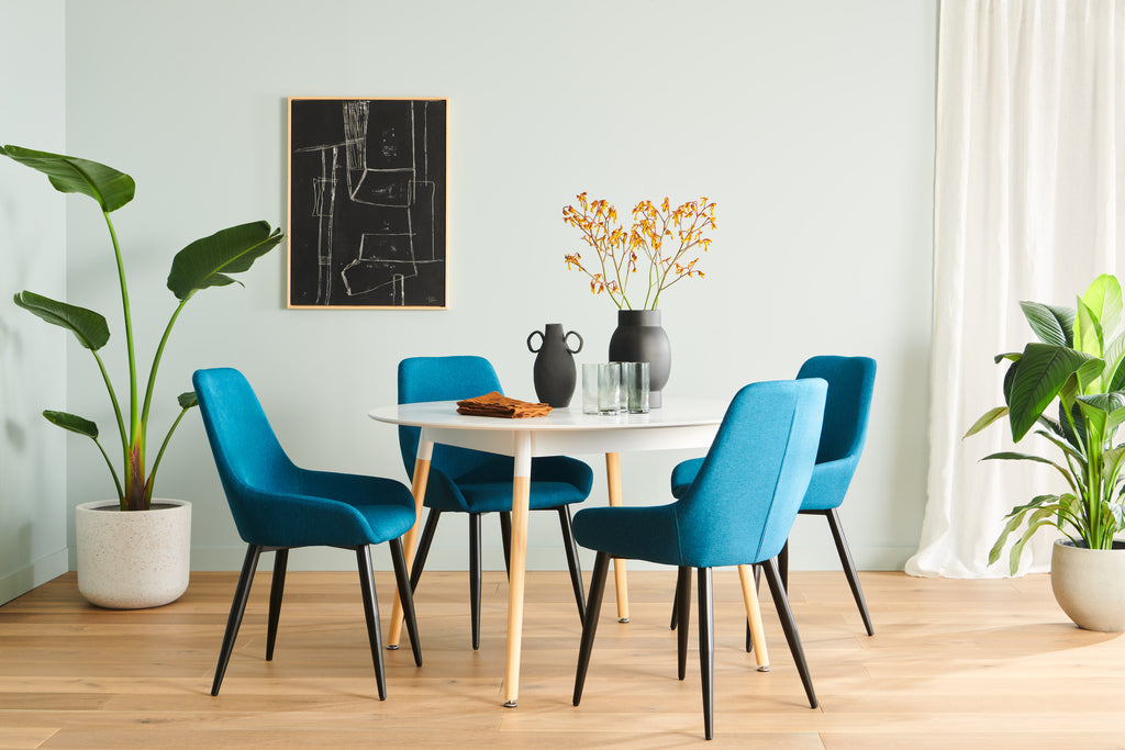 Dining Room with white dining table and clara dining chairs in teal