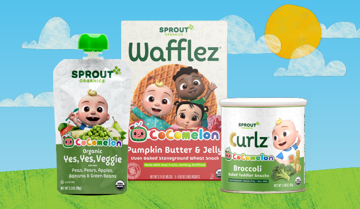 Three Sprout Organics CoComelon products: Yes, Yes, Veggie food pouch, Pumpkin Butter & Jelly Wafflez, and Broccoli Curlz sit on a sunny outdoor background.