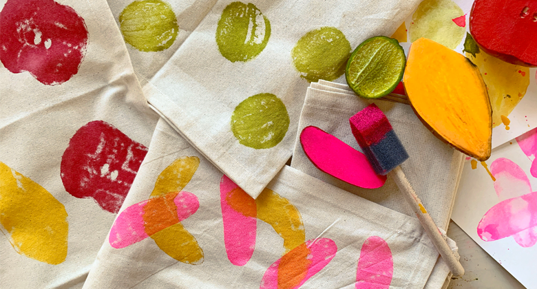 Fabrics covered in colorful stamps from fruit and veggie shapes