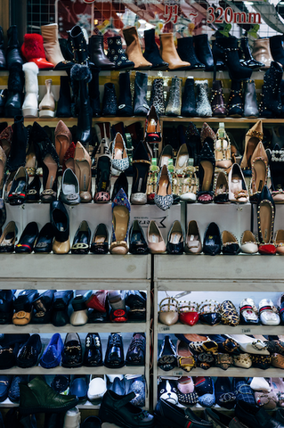 Assortment of used high-heeled shoes at thrift shop