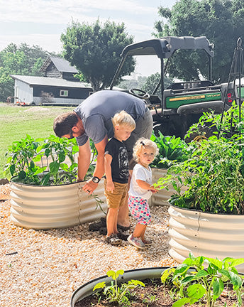 two kids accompany dad sort out a 17 inches tall white u shaped raised garden bed-Vegega