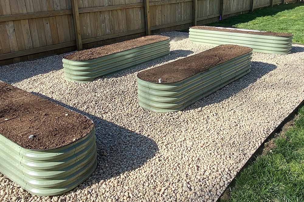 fill four 2x8 raised garden beds with soil.jpg__PID:bdef8a58-6b45-4035-aed1-4c379d0cc89a