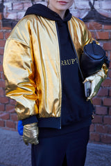 golden jacket,  gloves and black hoodie