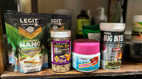 A shelf of wild and domestic betta fish food recommendations at Betta Botanicals.