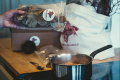 A boiling pot of aquarium botanicals on a stove at Betta Botanicals.