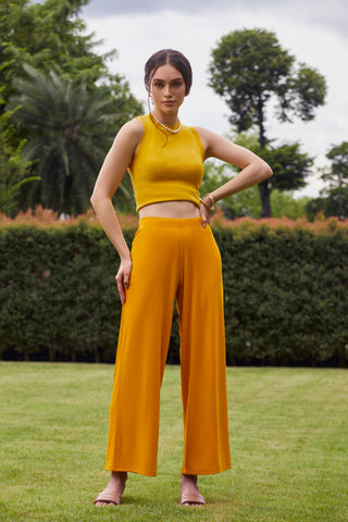 Image of a model dressed in Go Colors ribbed Palazzos.
