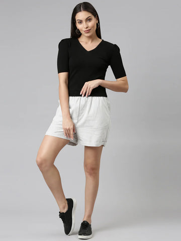 Image of a woman wearing Go Colors Linen Shorts.