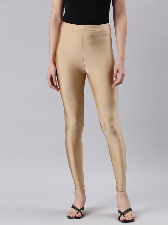 Girl in shiny top and shiny golden American Apparel leggings | SHINY NYLON