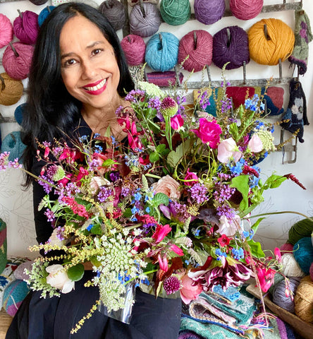 Image of Dee Hardwicke with a bouquet of flowers.