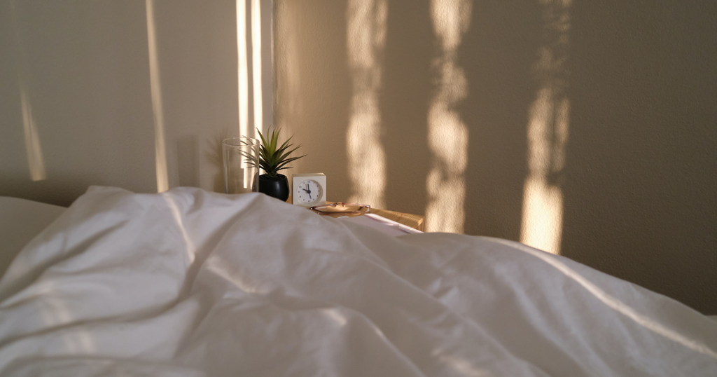 A bed during golden hour. really calming to represent the stress relieving benefits of ashwagandha