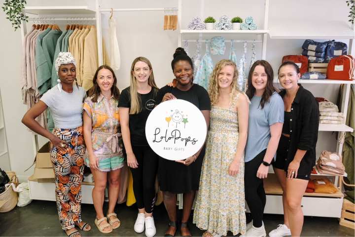 Group of women entrepreneurs in LoloPops Baby Gifts Store