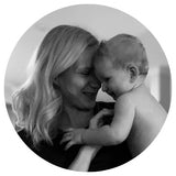 Black and white photo of Natalie with her daughter cuddling