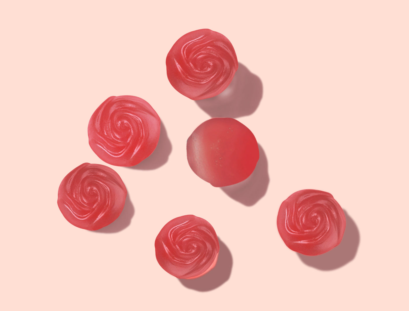 Feed That brain's red energy gummies with vitamin b12 and green tea extract sprawled out on a pink background