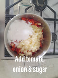 Add the tomato's, onions & sugar to a large pot.