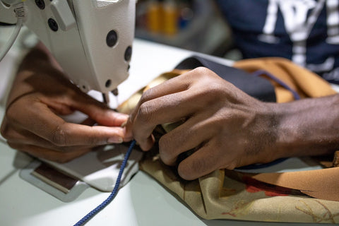 Man using an industrial sewing machine. Photo by nappy from Pexels