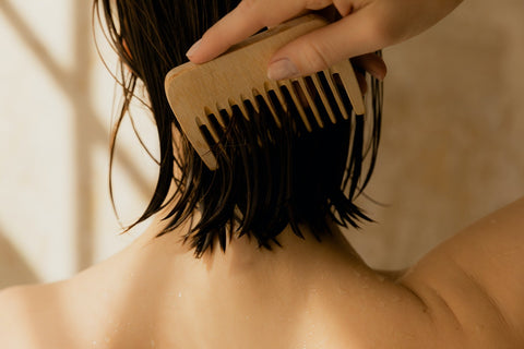 comb running through wet hair