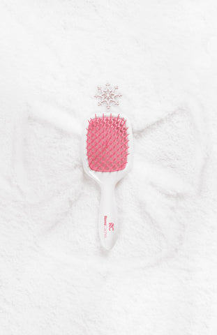 a hairbrush on snow