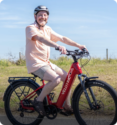 Man riding Velotric Discver 2 ebike happily