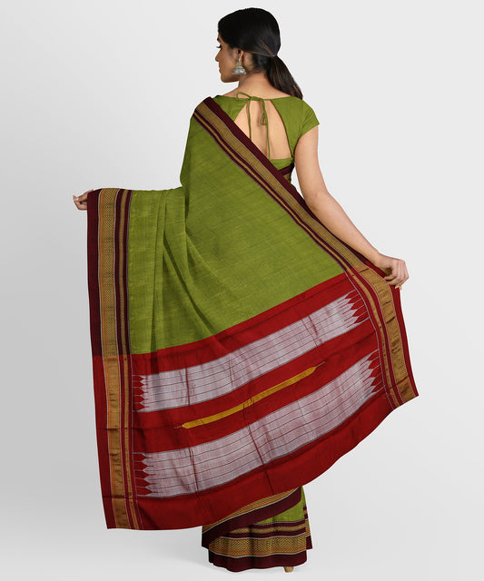 Dhammanagi Textiles - This pure silk Ilkal saree has vibrant green solid  color with contrast border and tope pallu. The temple design on the border  adds elegance to the saree. The pallu