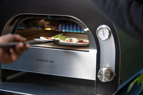 Baking a pizza in a luxury Fontana Forni oven