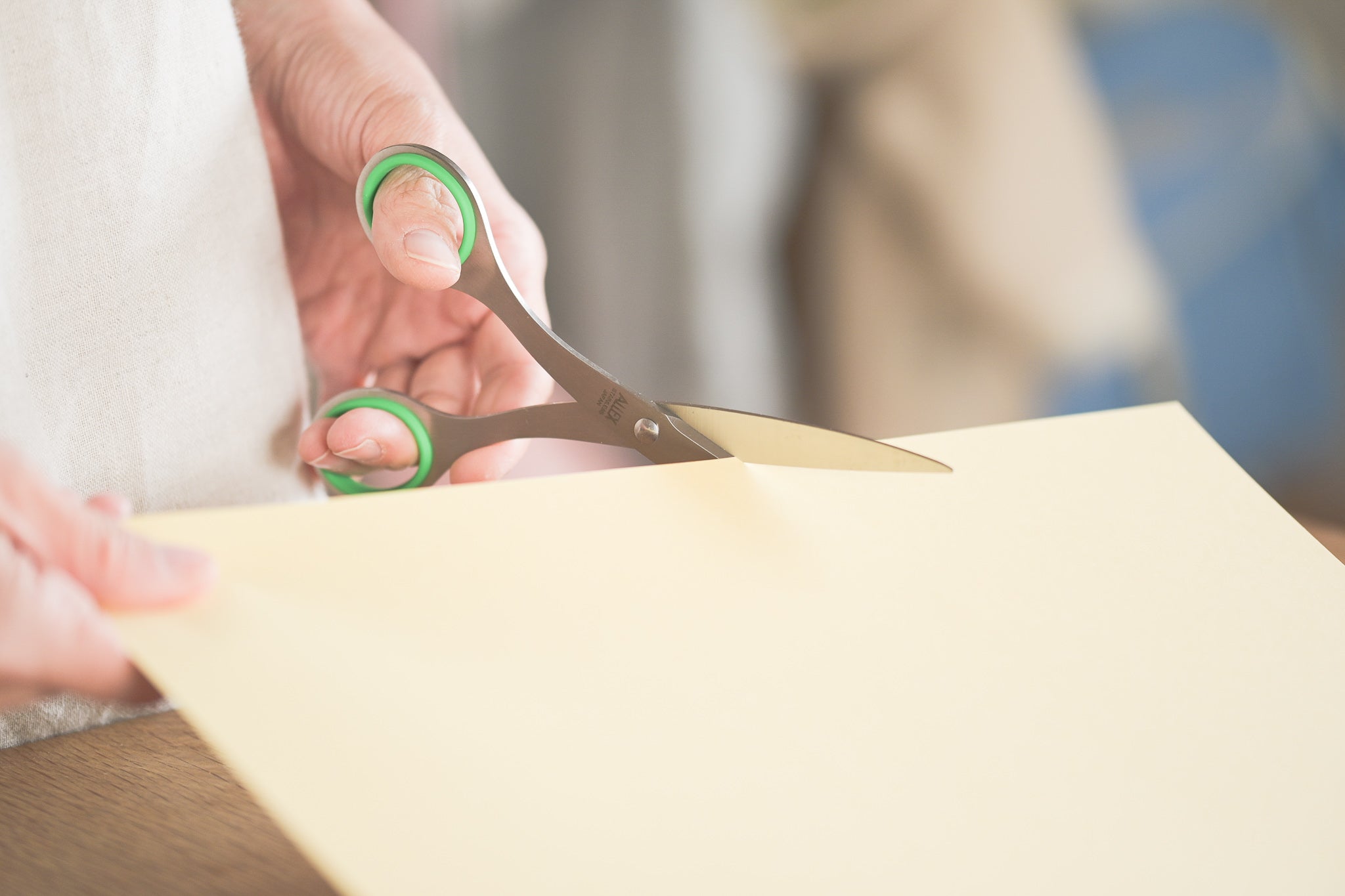 Cutting paper with ALLEX All-Purpose Scissors (Medium Size) for Left-Handers