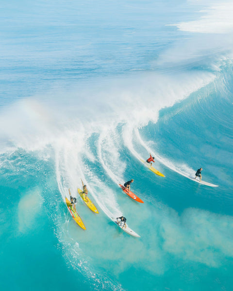 bunch of people surfing
