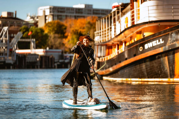 Woman on SUP Dressed as a witch