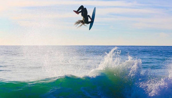 Catching air on a Skimboard