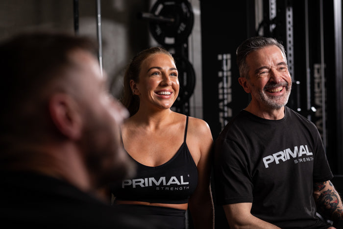 Man and Woman laughing together at the gym 