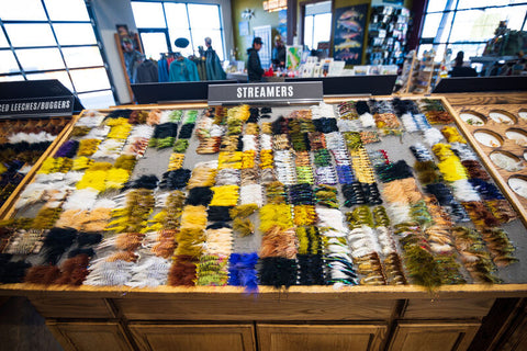 A large row of streamer patterns on sale at a local fly shop.