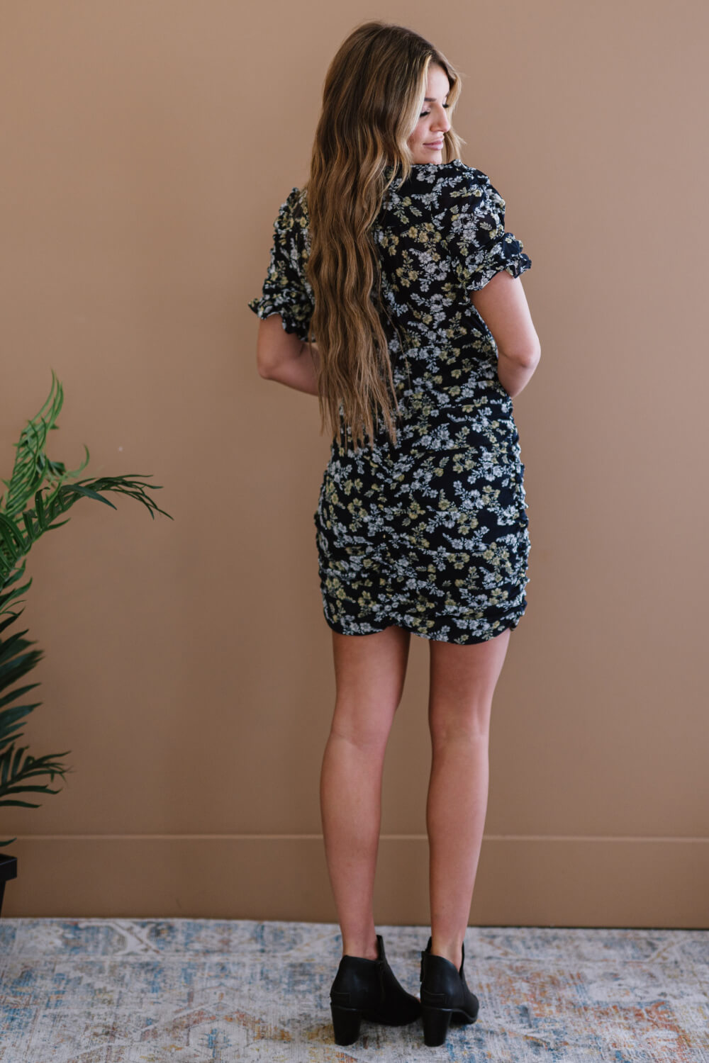 Woman wearing Navy Floral Ruched Mini Dress