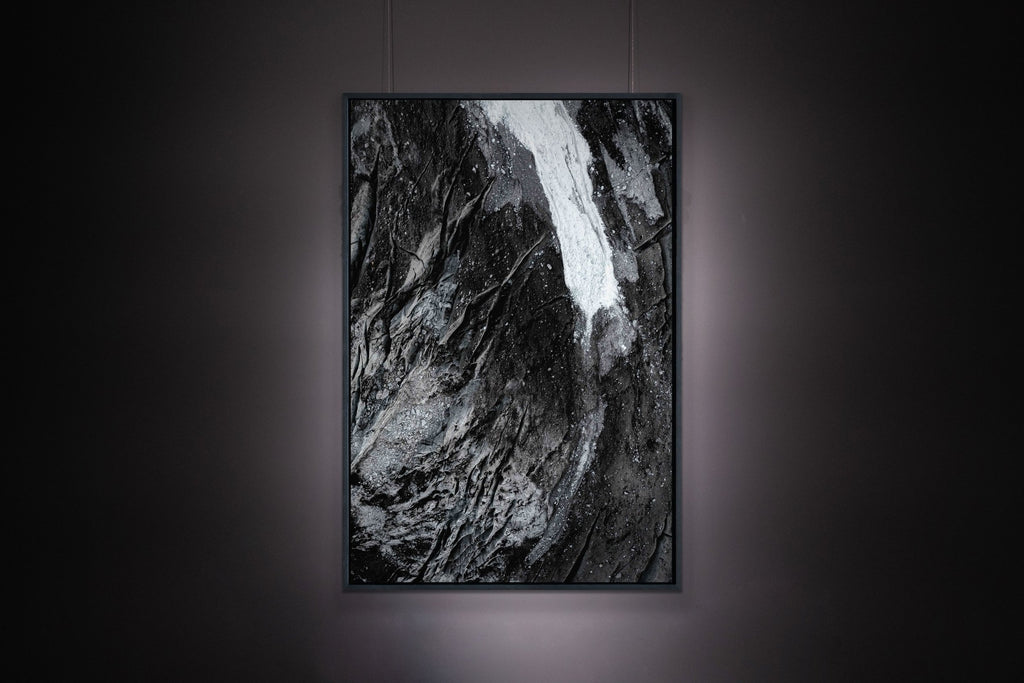 Fine-art photography print hanging on wall with indirect lighting