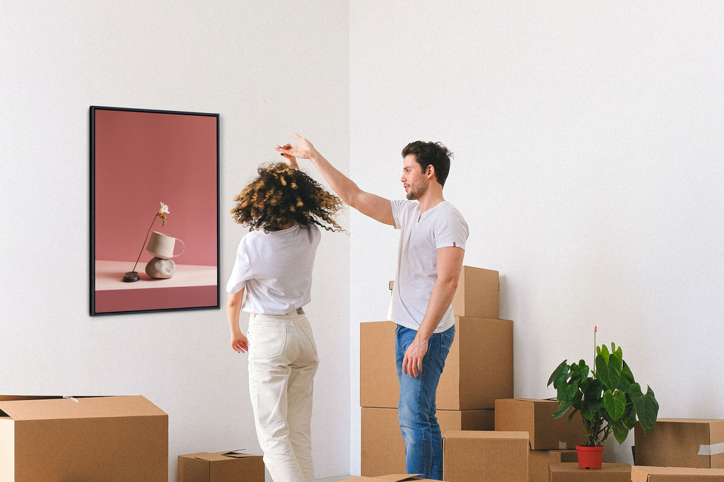 dancing couple in a room with art on the wall