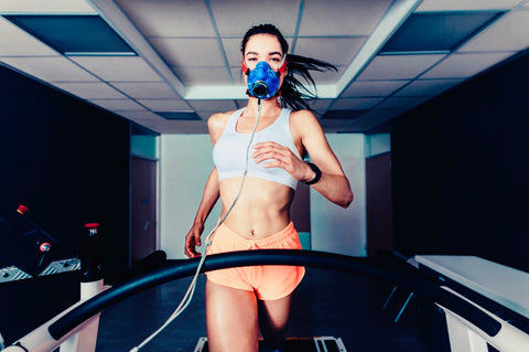 women running on treadmill testing vo2max performance