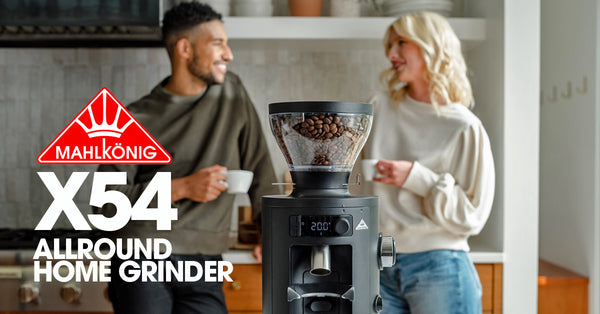 A couple is enjoying a cup of coffee made with Mahlkönig X54 Allround Home Grinder