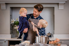 Eddie Copley-Farnell baking brownies with his children