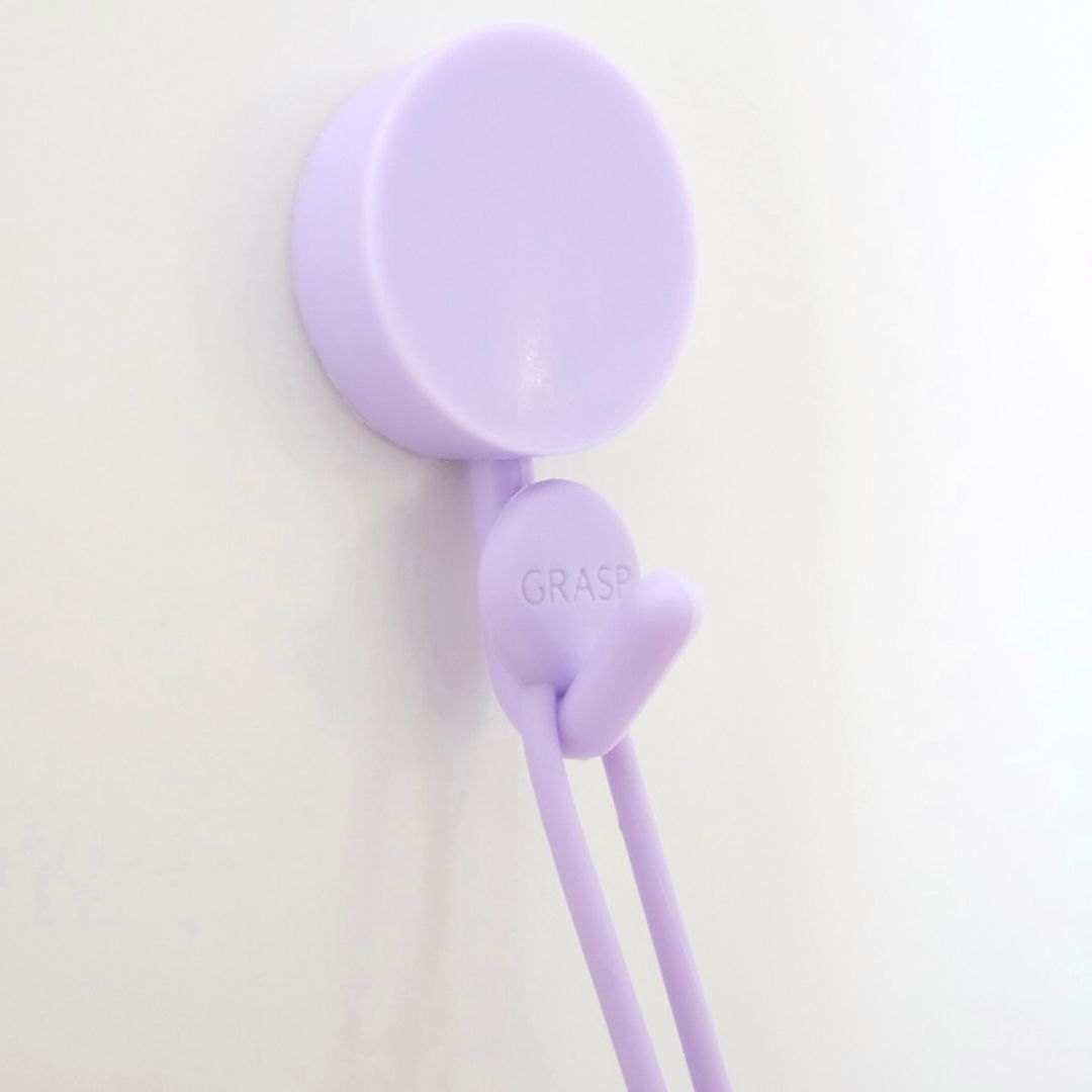 Pebbl bath brush comes with a cord and hook to hang in your bath or shower