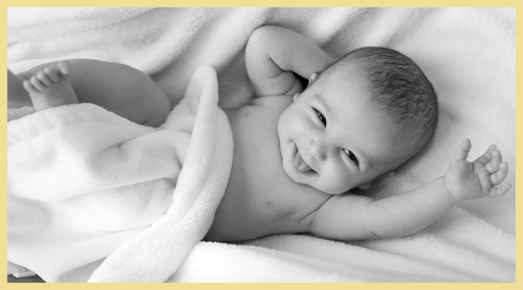 new born baby drying in a towel